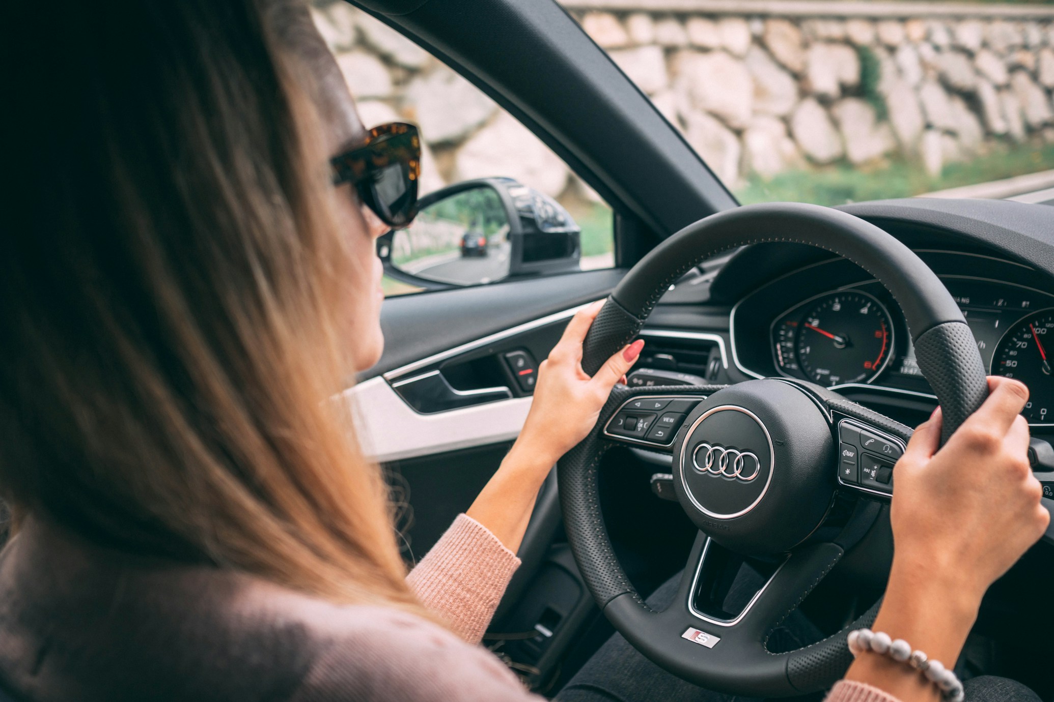 Woman driving car with confidence